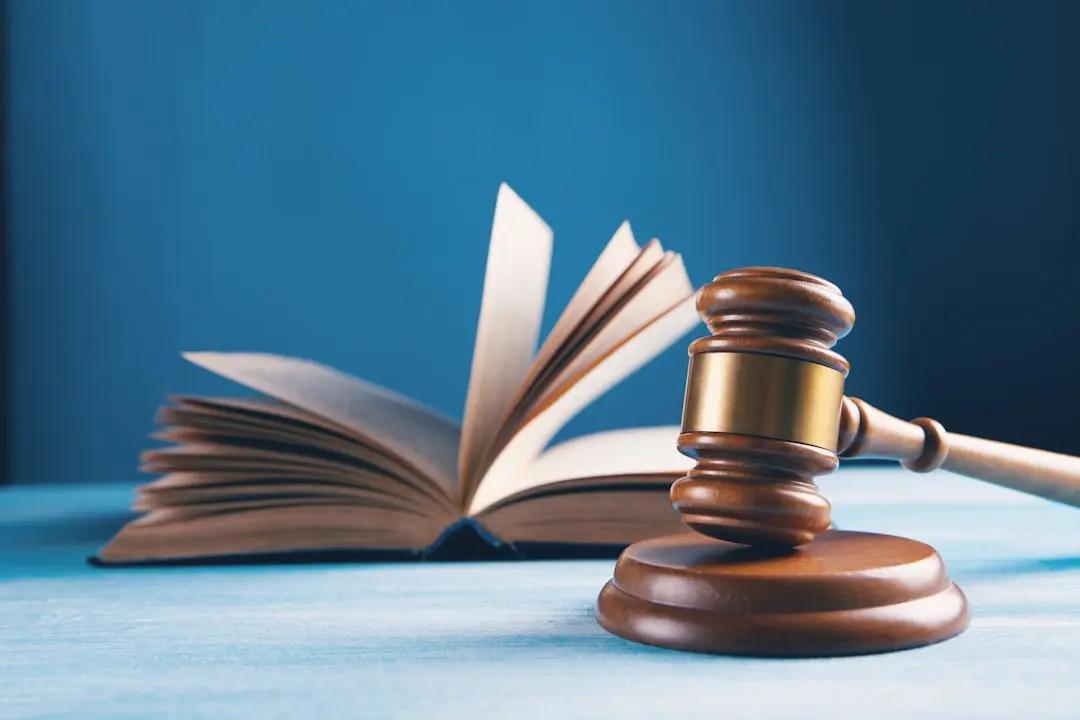 A desk with legal documents and a gavel