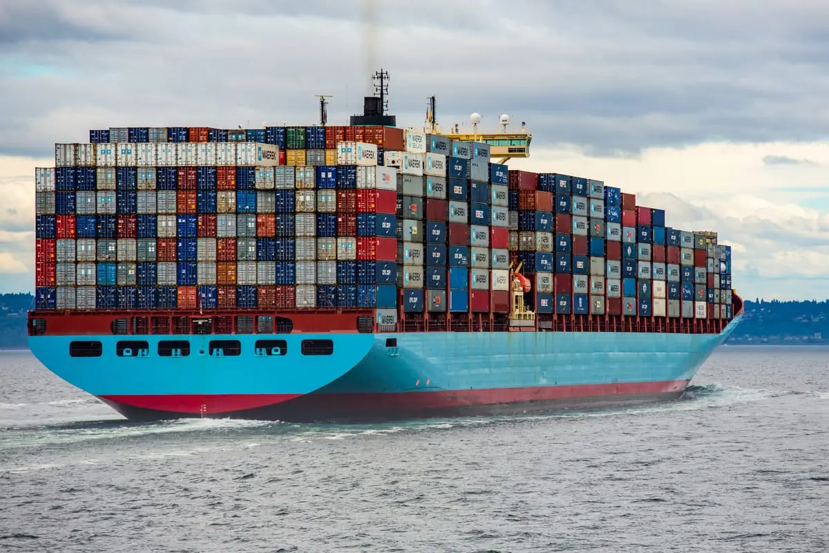 A container ship at sea, loaded with cargo containers
